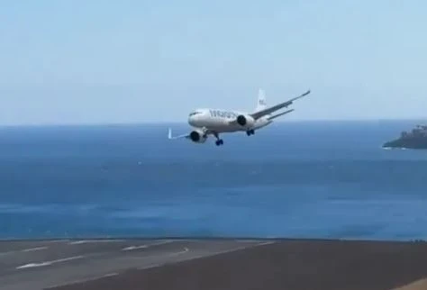 Watch 'scary as hell' landing at hols airport as plane barrels & BOUNCES