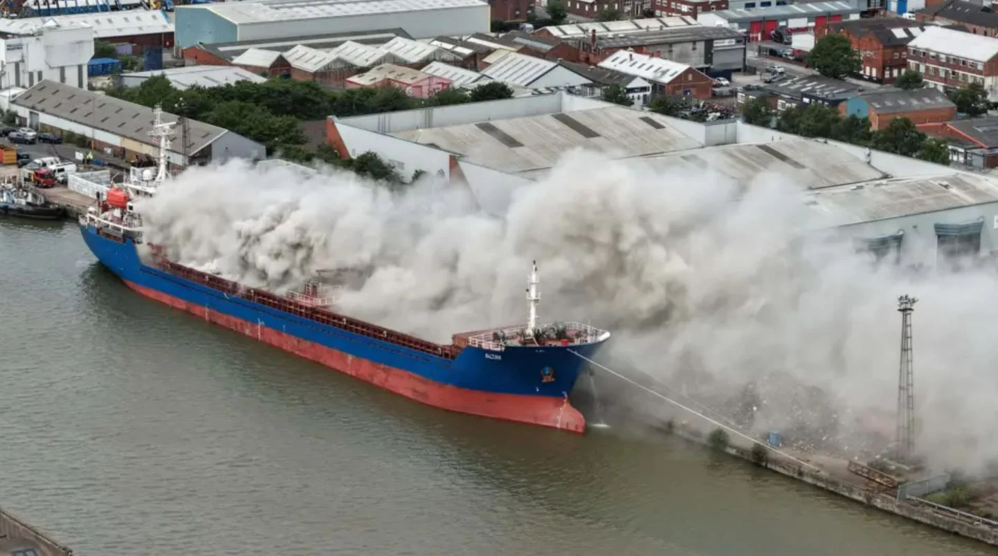 Blaze tears through huge container ship at UK dock sending smoke billowing
