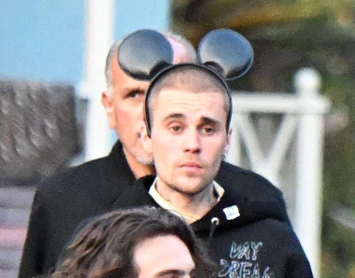 Justin Bieber looks pale and drawn as he visits 'happiest place on earth'