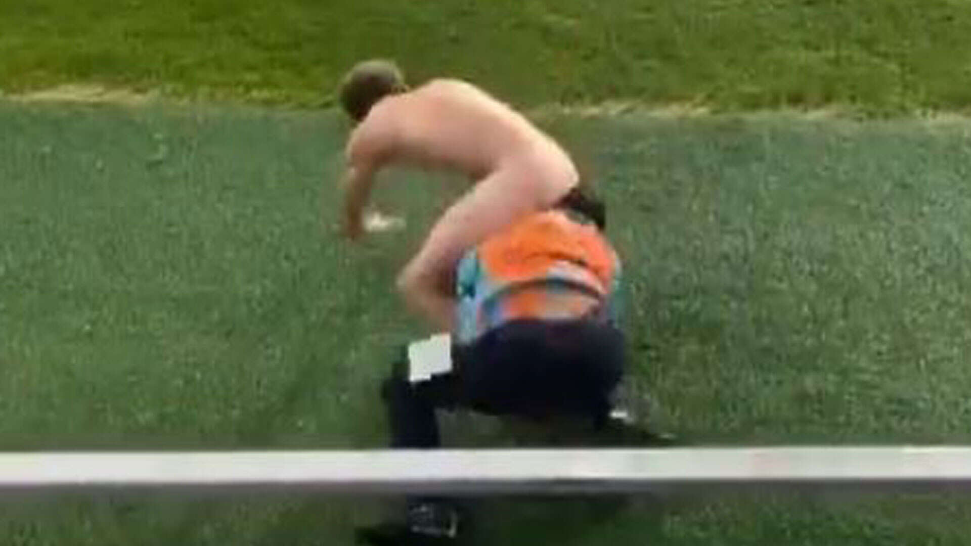 Shocking moment steward wrestles streaker and ends up with BUM in his face