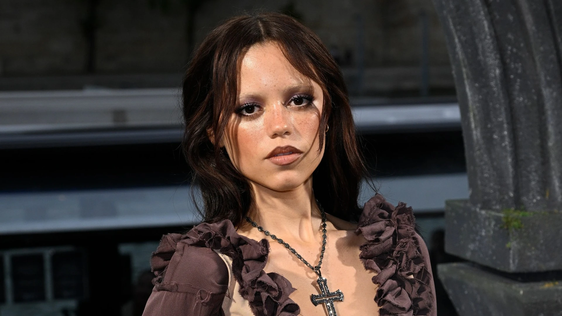 Spooky Jenna ruffles feathers in frilly dress at Wednesday premiere