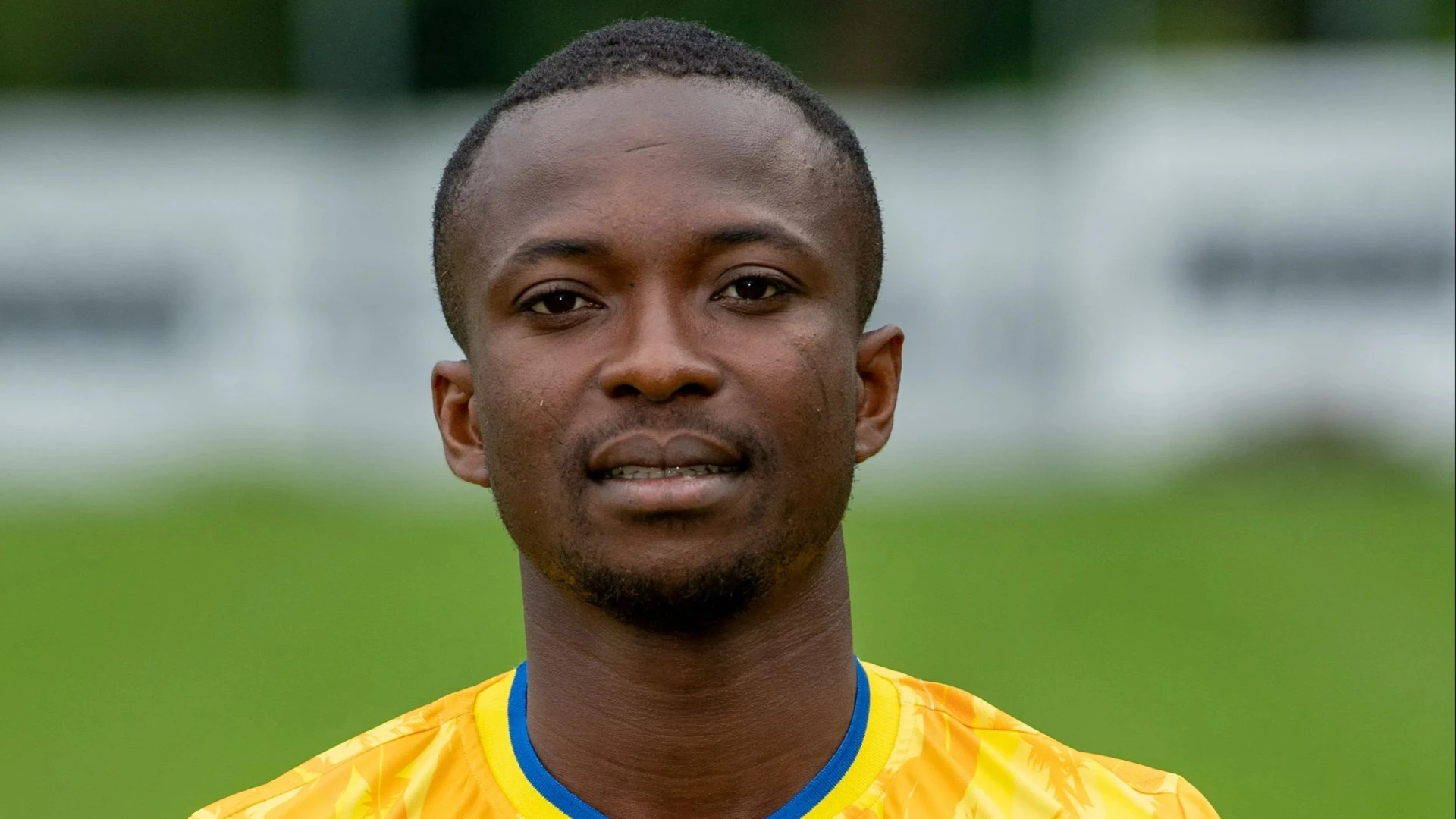 Footballer 'risks paralysis' after breaking neck in collision with hoarding