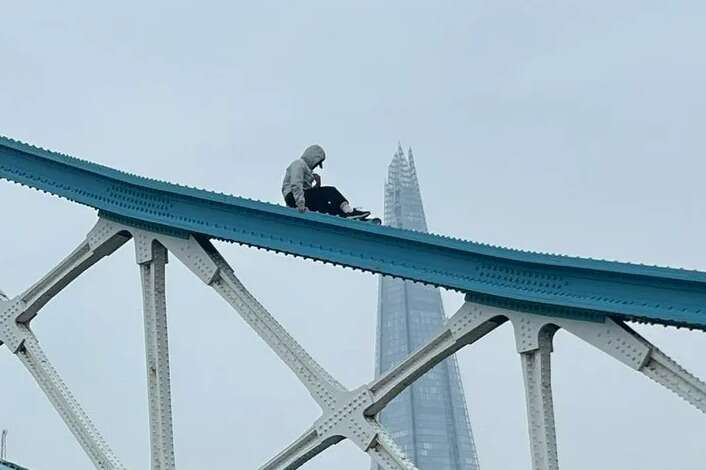 Tower Bridge CLOSED as man climbs up iconic landmark & sits on railings