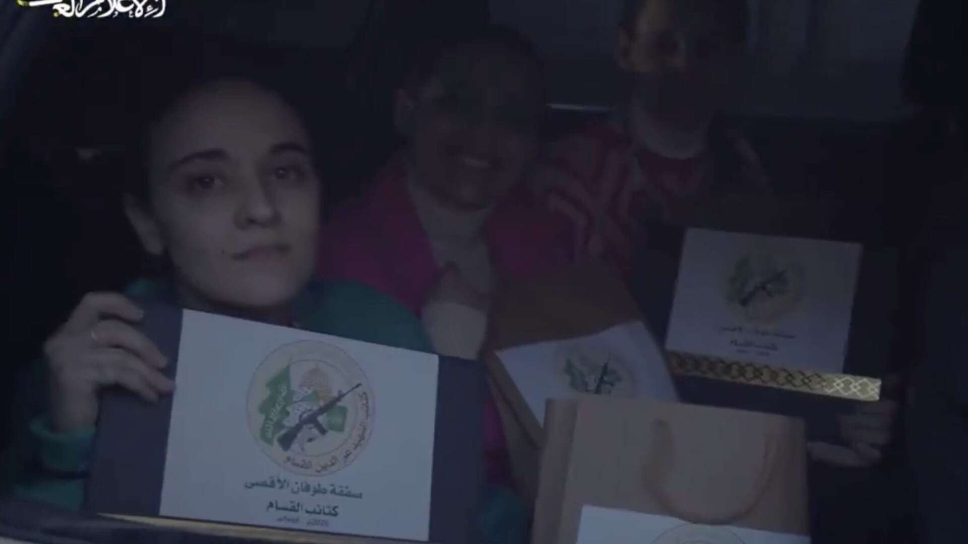 Vile moment Israeli hostages given 'GIFT BAGS' by Hamas before being freed