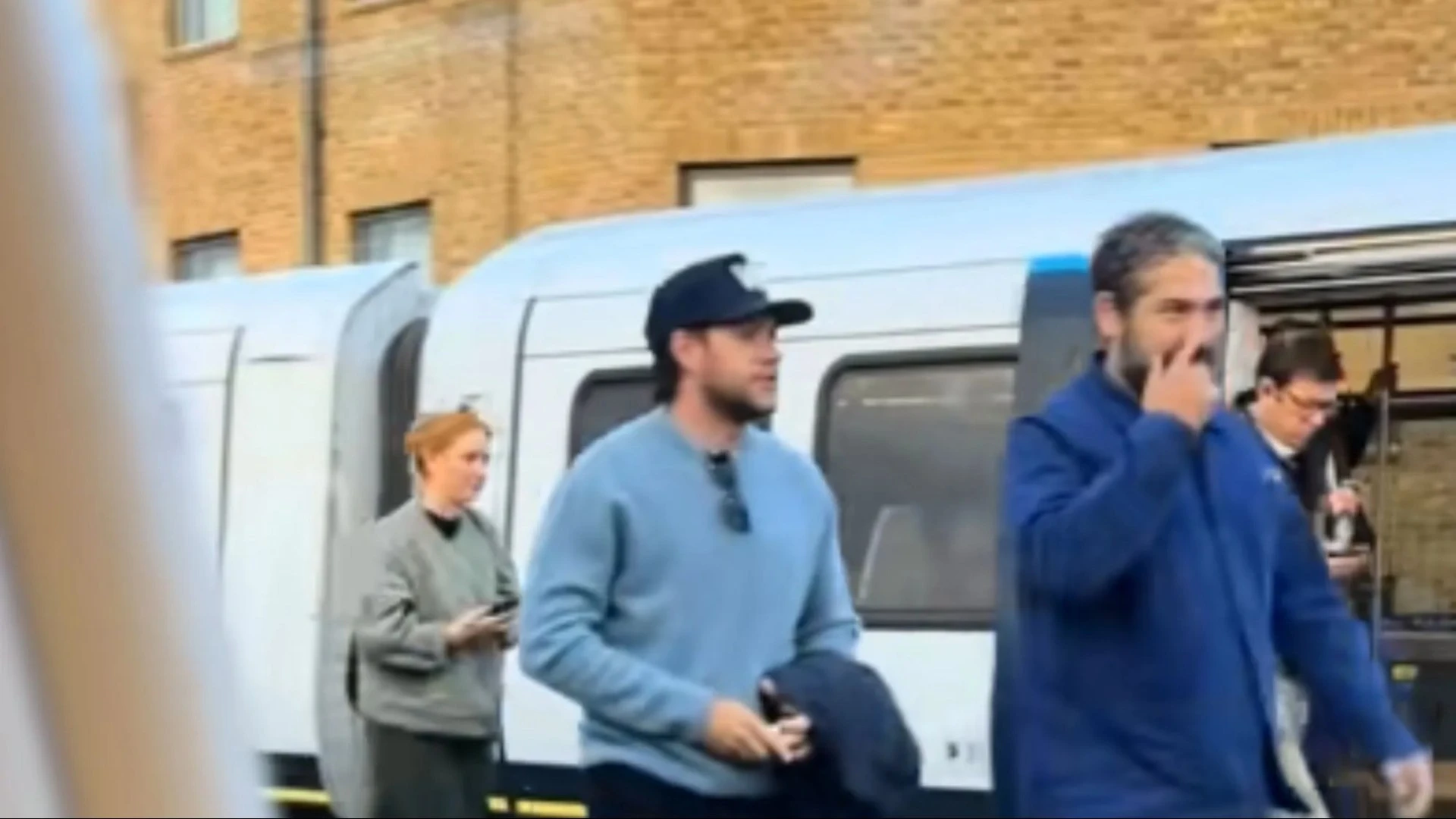 Commuters stunned as pop star hops off train - would you have spotted him?