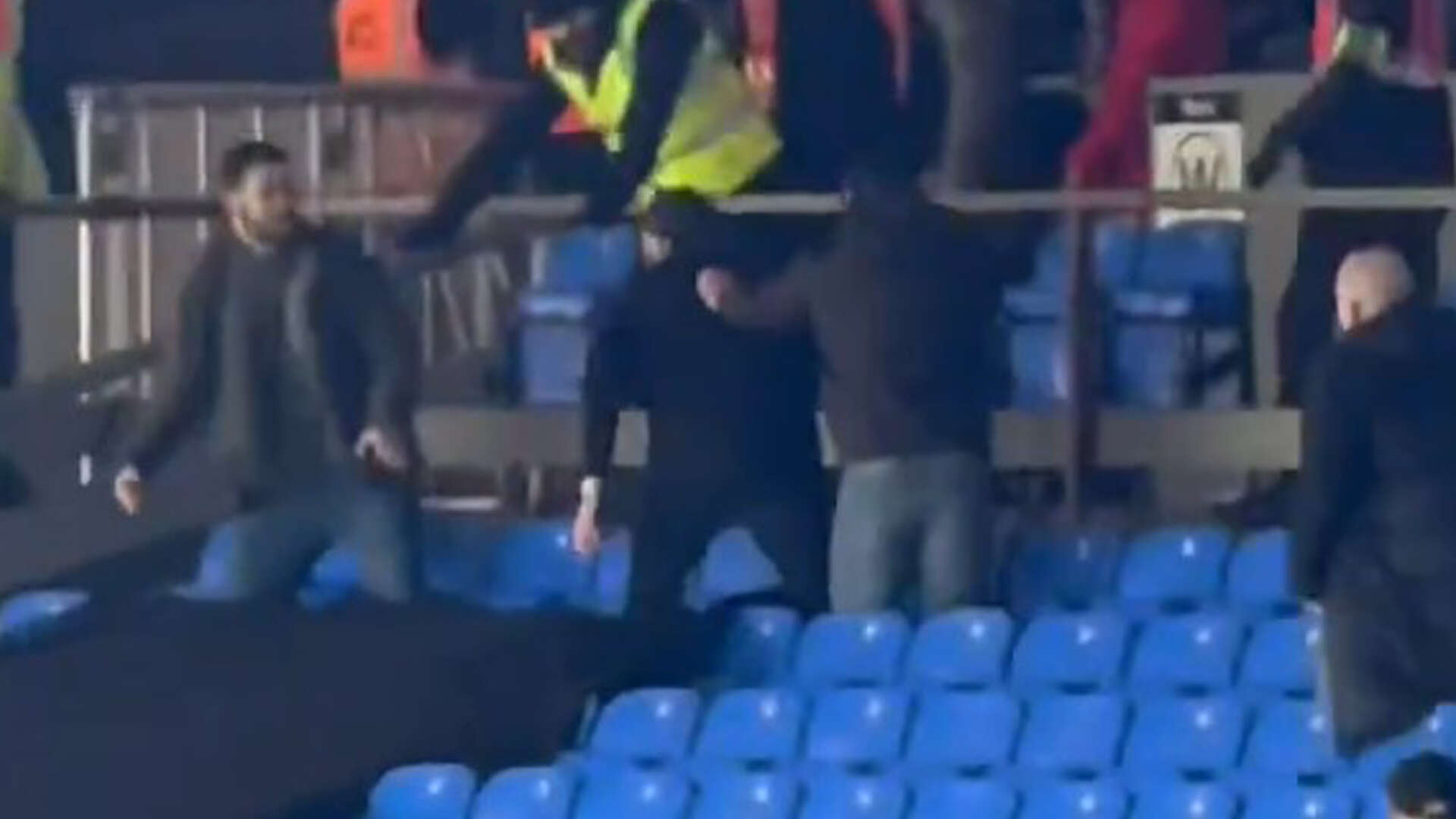 Shocking moment Millwall fan sparks brawl after climbing into Palace end