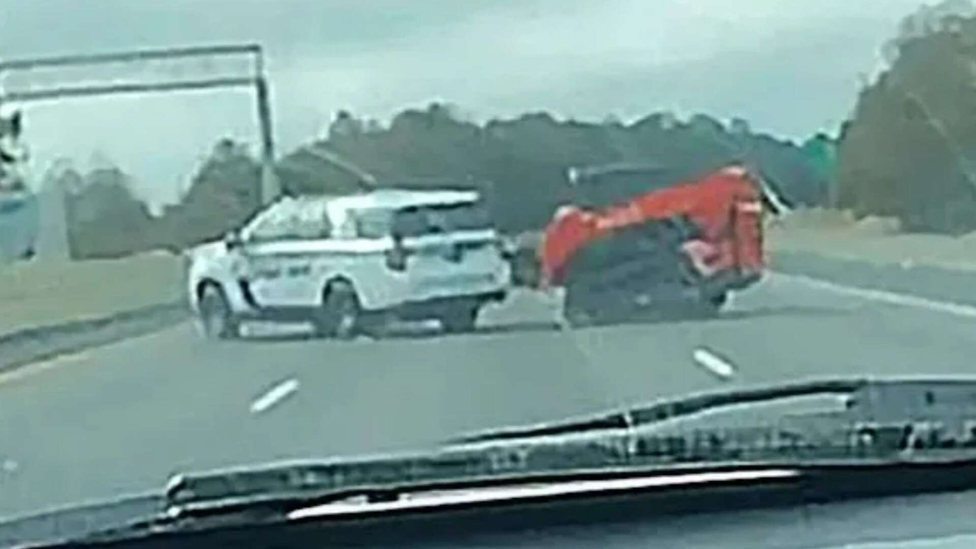 Moment digger driver leads 15 cop cars on bizarre chase before being shot