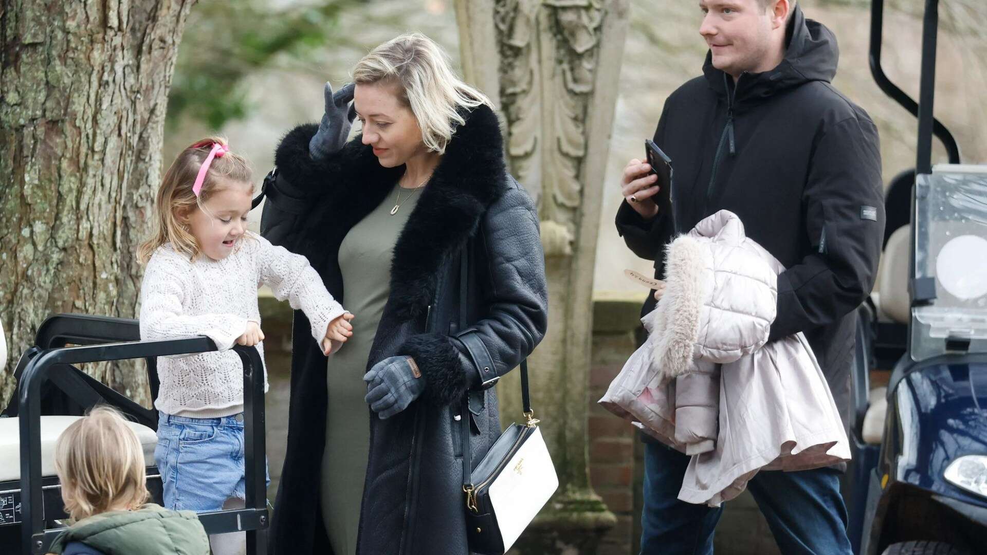 Tom Parker's pregnant widow Kelsey shows off growing baby bump on family day out