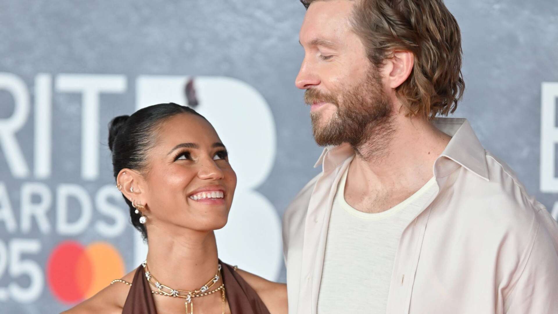 Vick Hope looks incredible in plunging dress as she cosies up to Calvin Harris