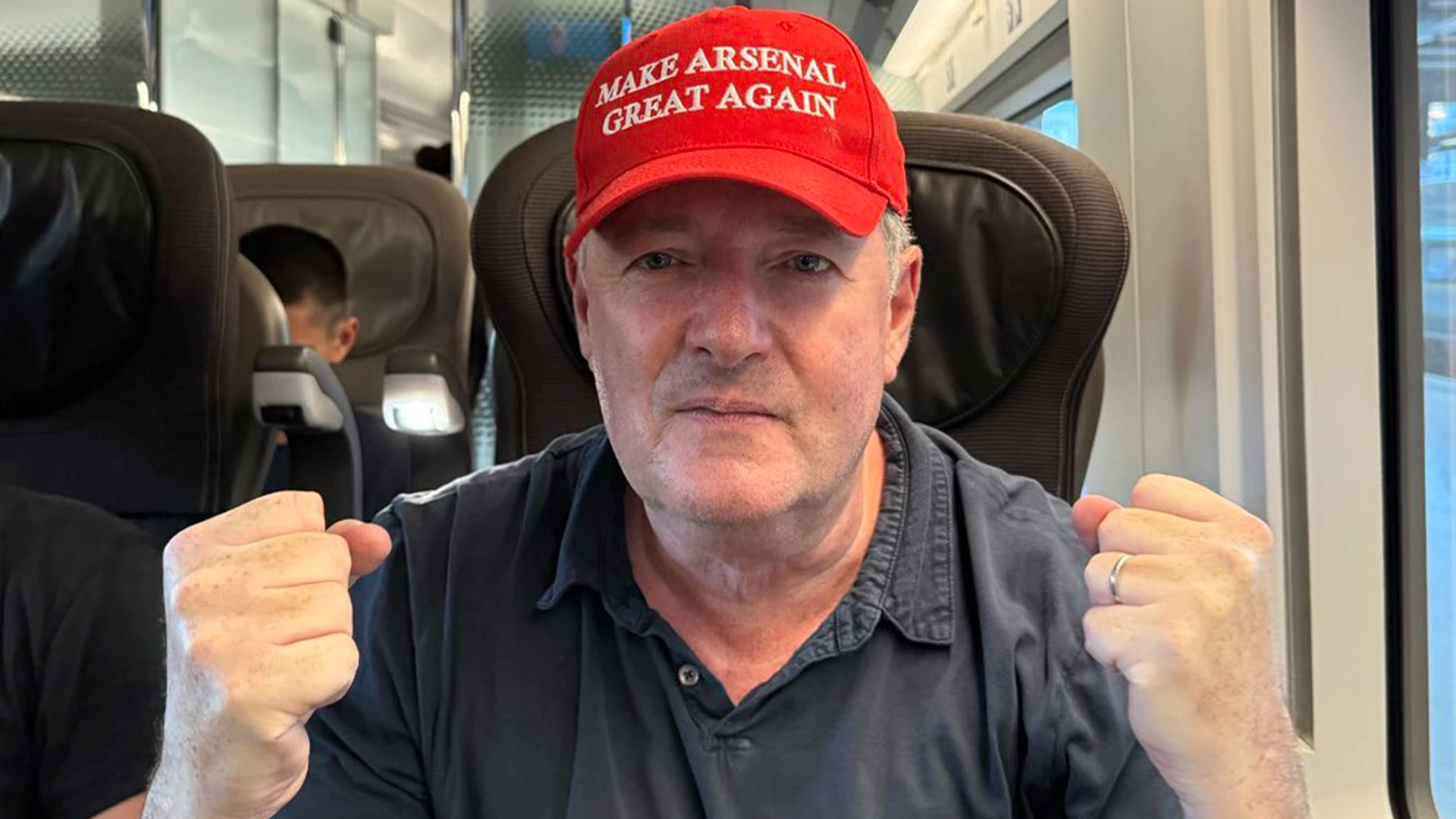 Piers Morgan wears 'Make Arsenal Great Again' hat as fans arrive in Paris