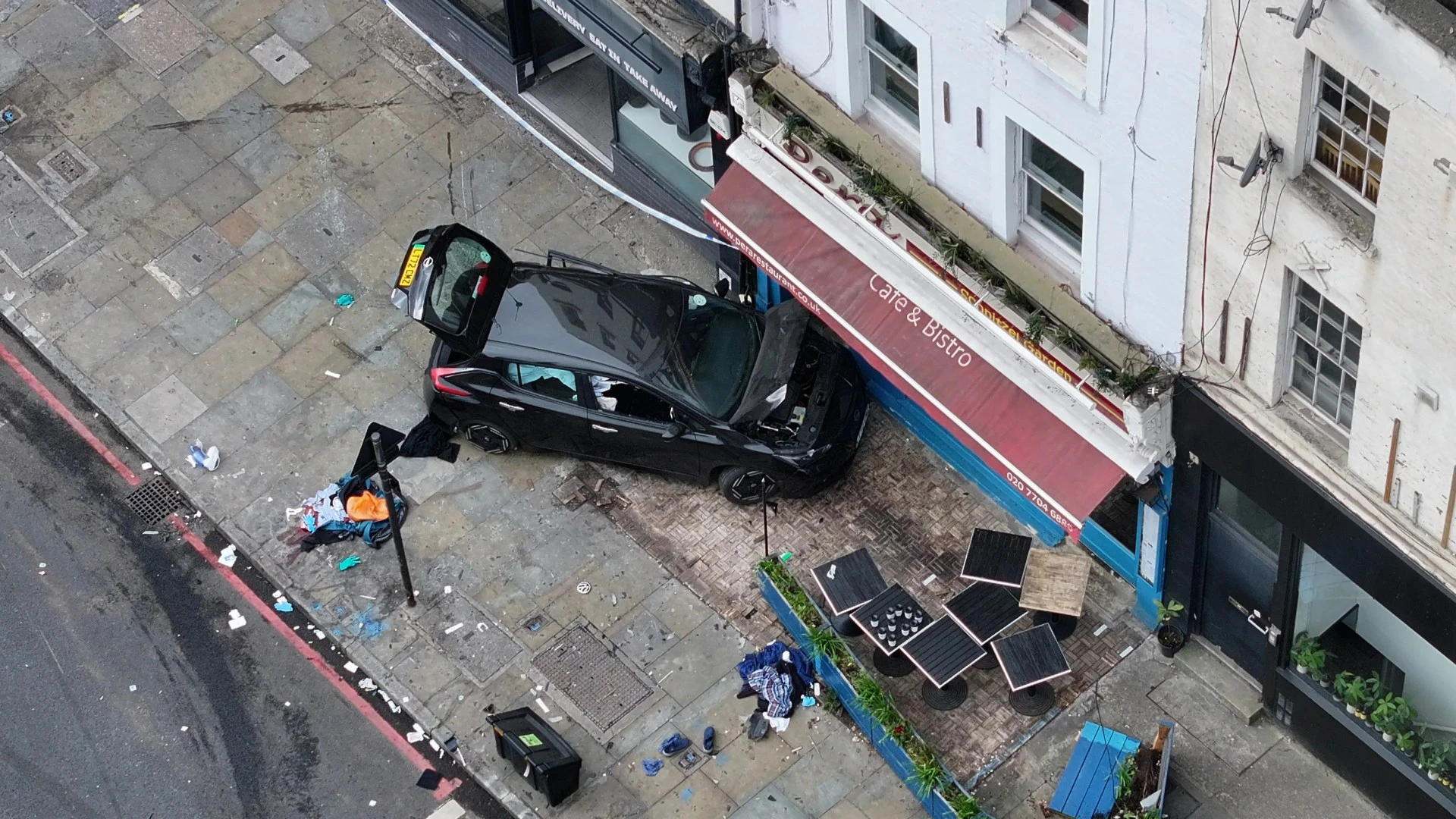 Pedestrian hit by car before motor ploughs into cafe in horror triple crash