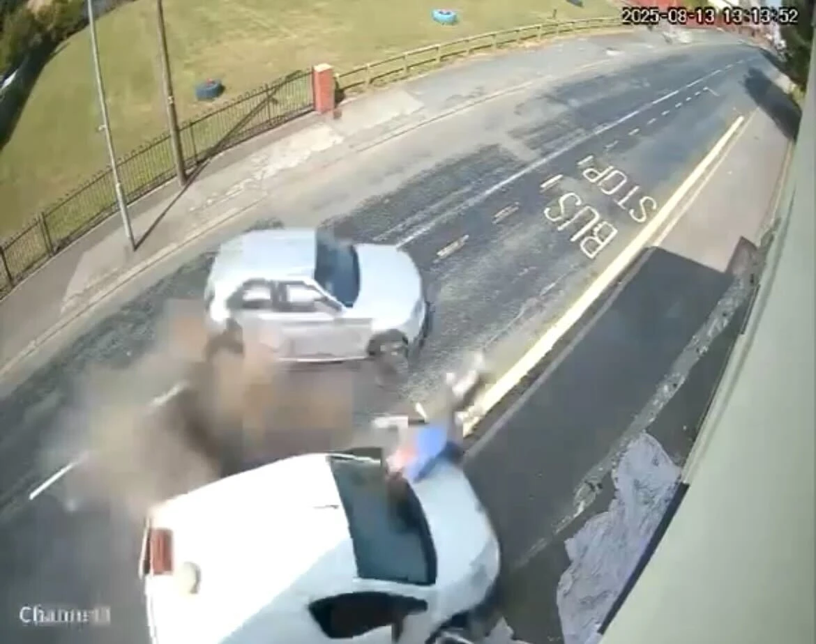 Moment painter is flung through air in horror crash as car comes out of nowhere