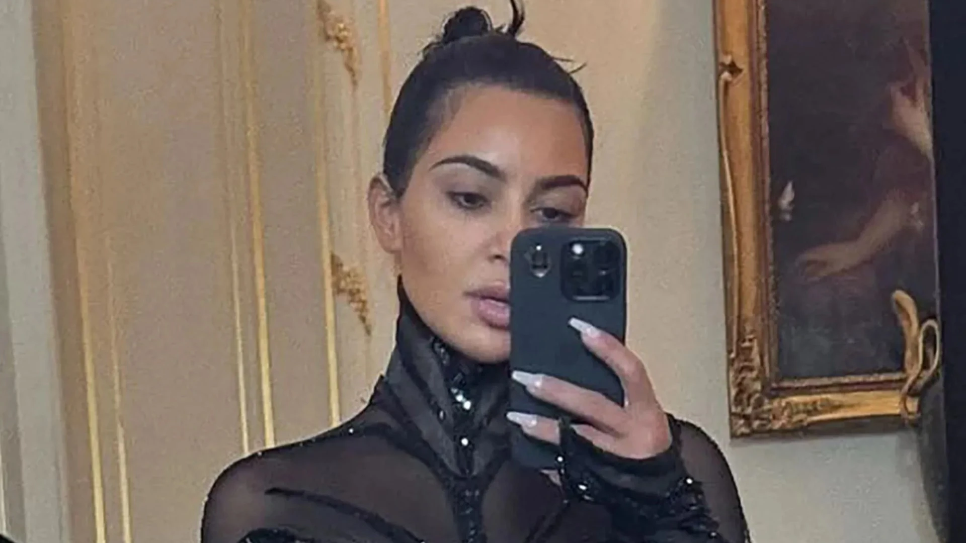 Kim Kardashian slammed as she shows off 'impossibly tiny' waist in corset