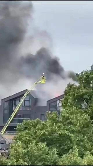 Huge blaze erupts at UK tower block as plume of black smoke billows into sky