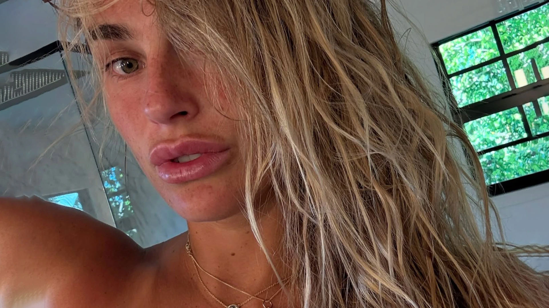 Three-time Grand Slam winner, 27, drives fans wild as she poses topless