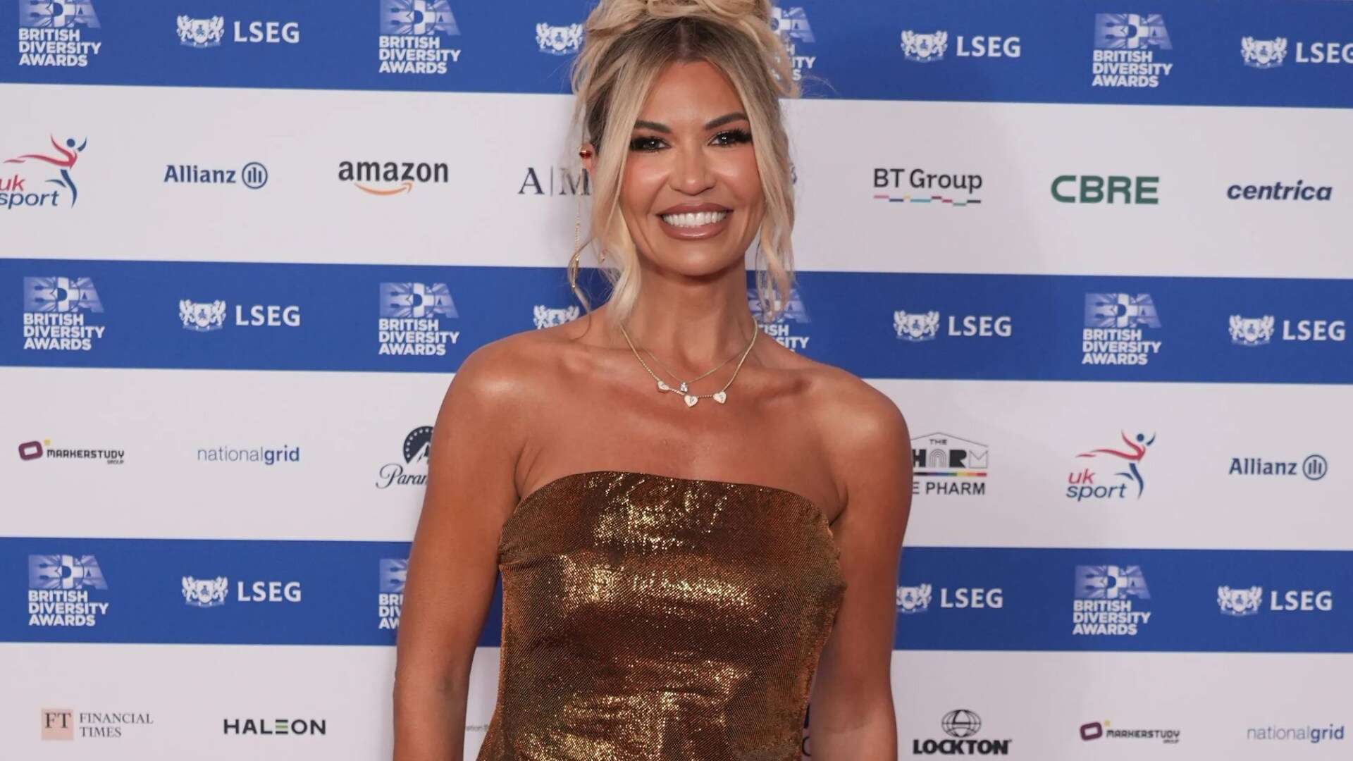 Christine McGuinness looks stunning in strapless gold dress