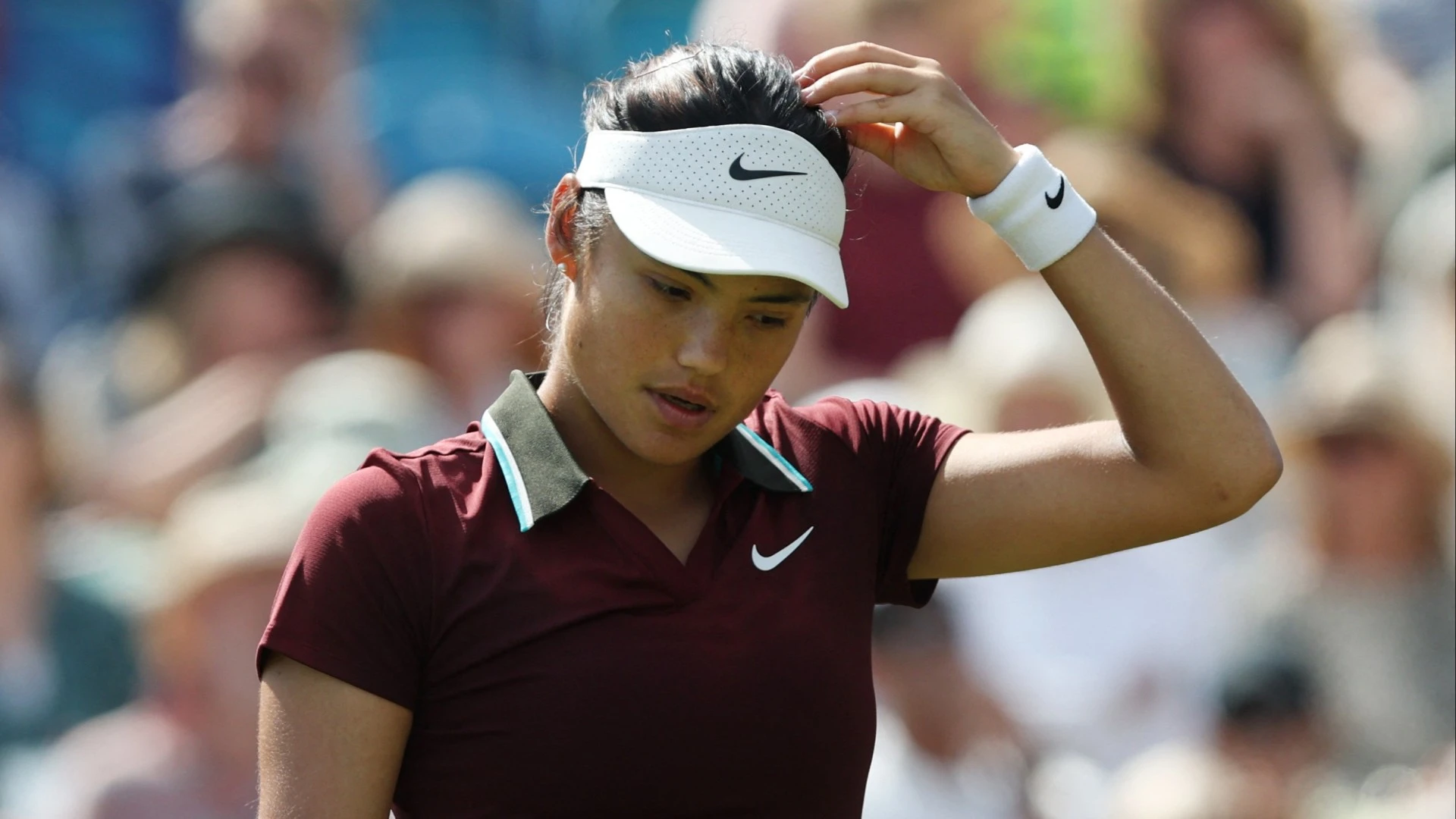 Emma Raducanu grimaces out of Eastbourne to leave cloud over Wimbledon hopes