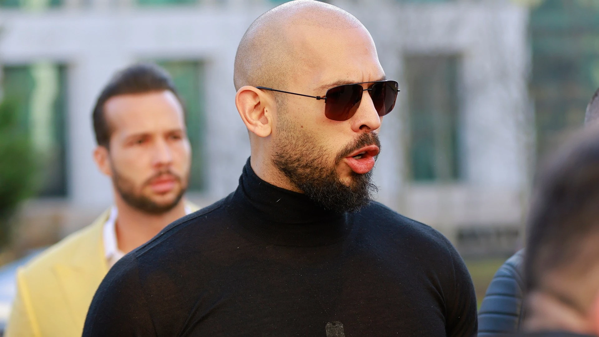 Tate 'pointed gun at Brit accuser' & said 'I've killed before', new docs show