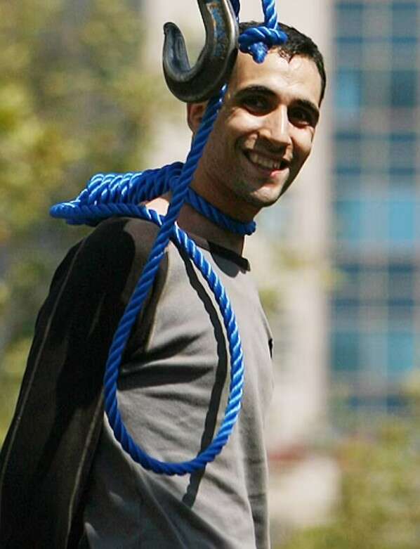 Incredible photo shows Iranian grinning moments before he was executed