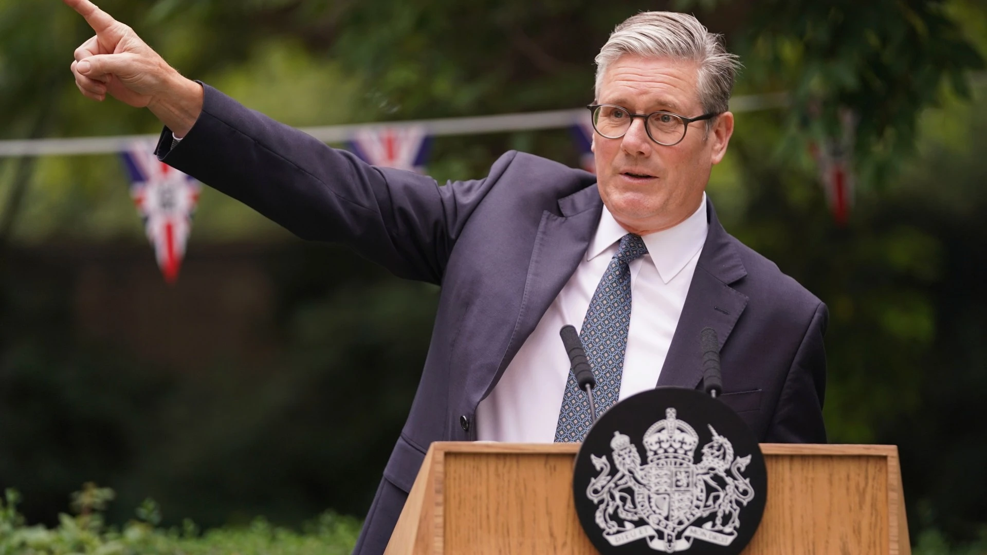 PM says he'll close migrant hotels early but can't say when as he slams Farage