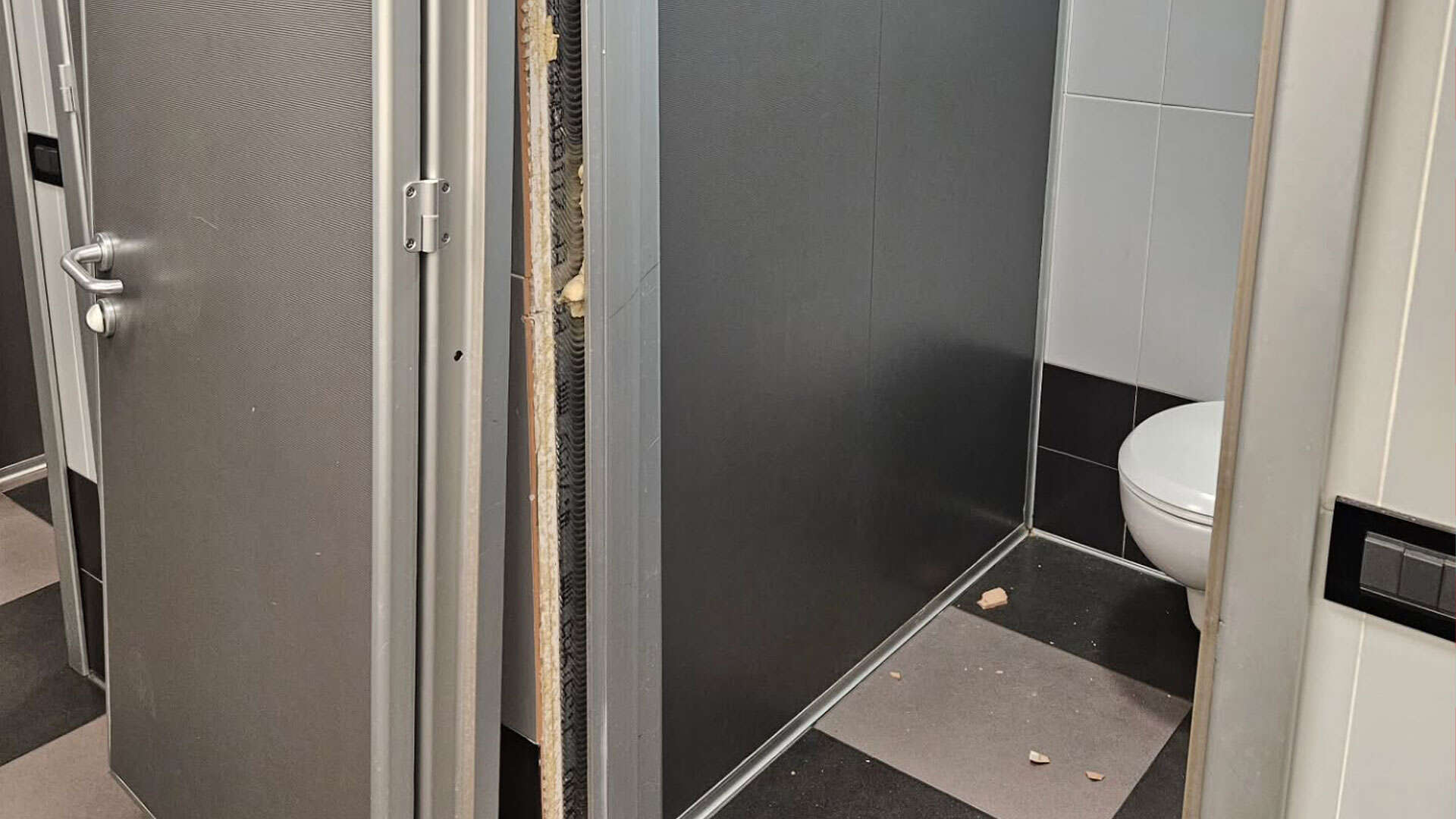 Former F1 world champion boots toilet door down and has ceiling fall on him