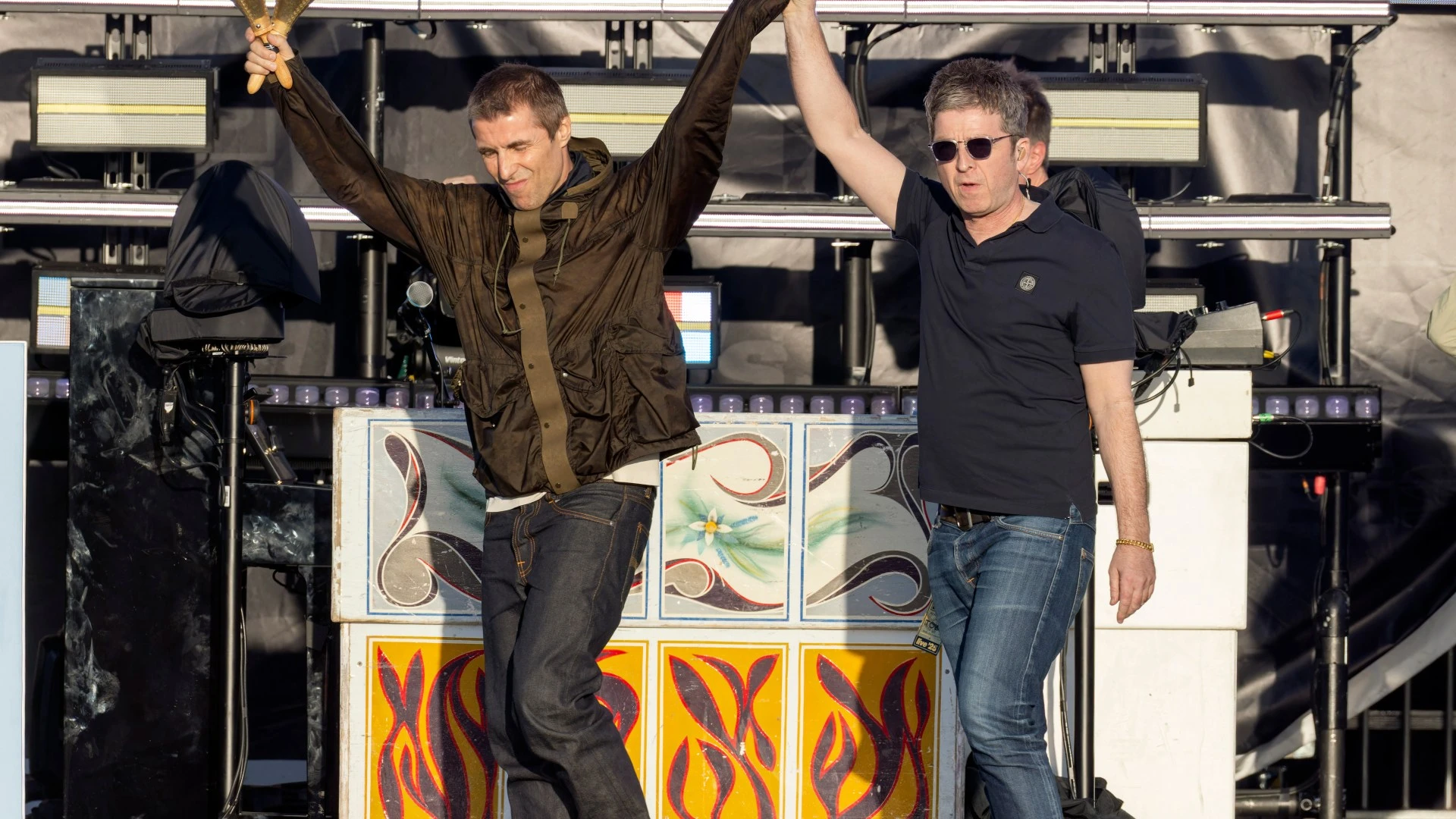 Liam and Noel hold hands on stage as Oasis fans go wild at first Manchester gig