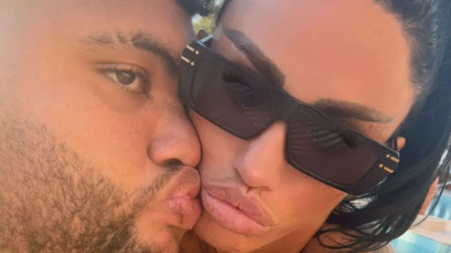 Katie Price shows off new face as she kisses son Harvey by pool on holiday