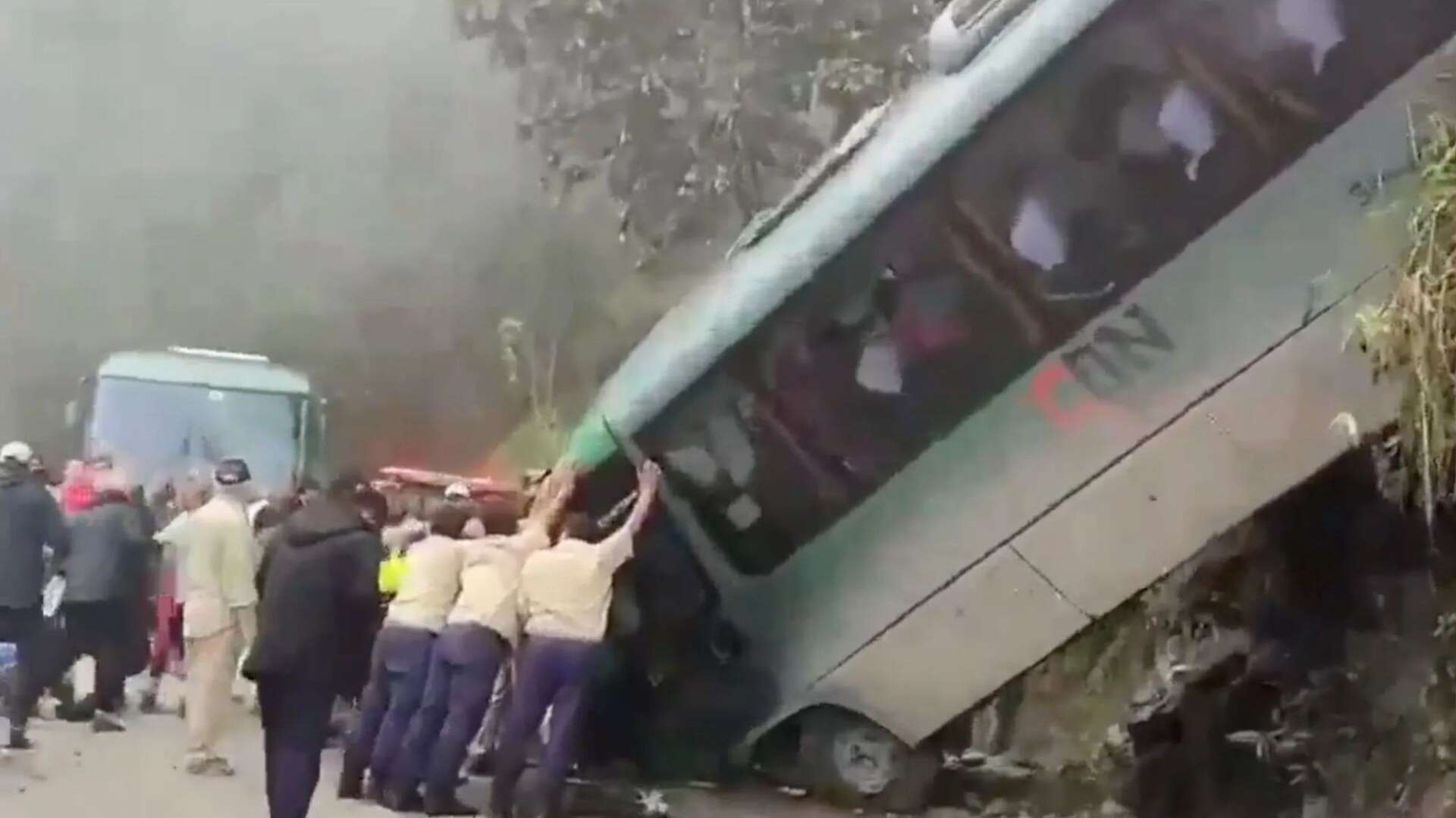 Tourist bus plunges off cliff at landmark as locals try to stop it rolling