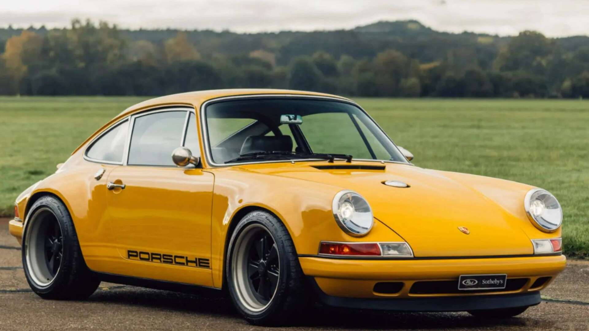 Porsche 911 in rare Egg Yolk yellow with black leather seats for sale at £850k