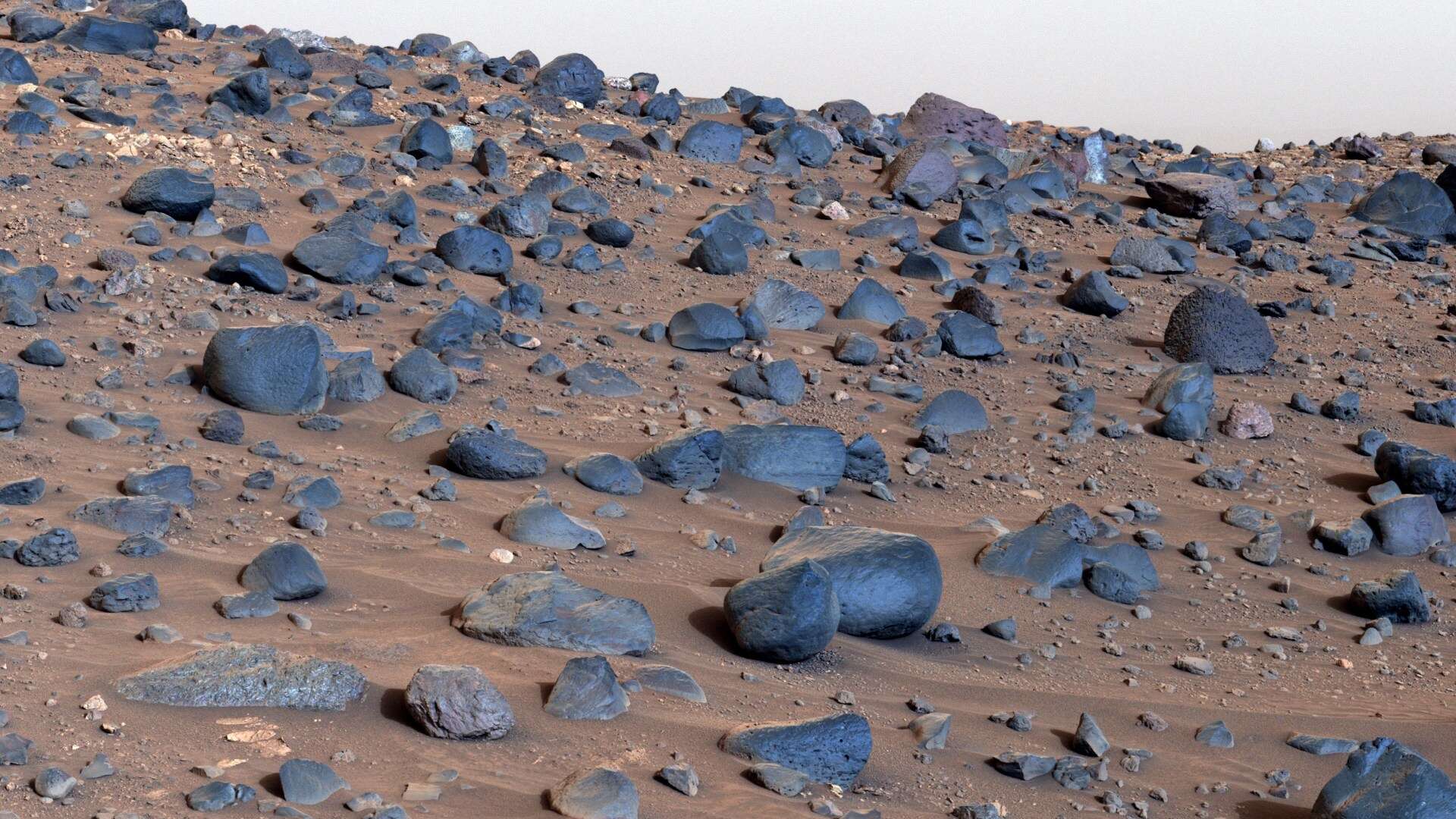 Remarkable images show eerie Mars view scattered with mysterious blue rocks