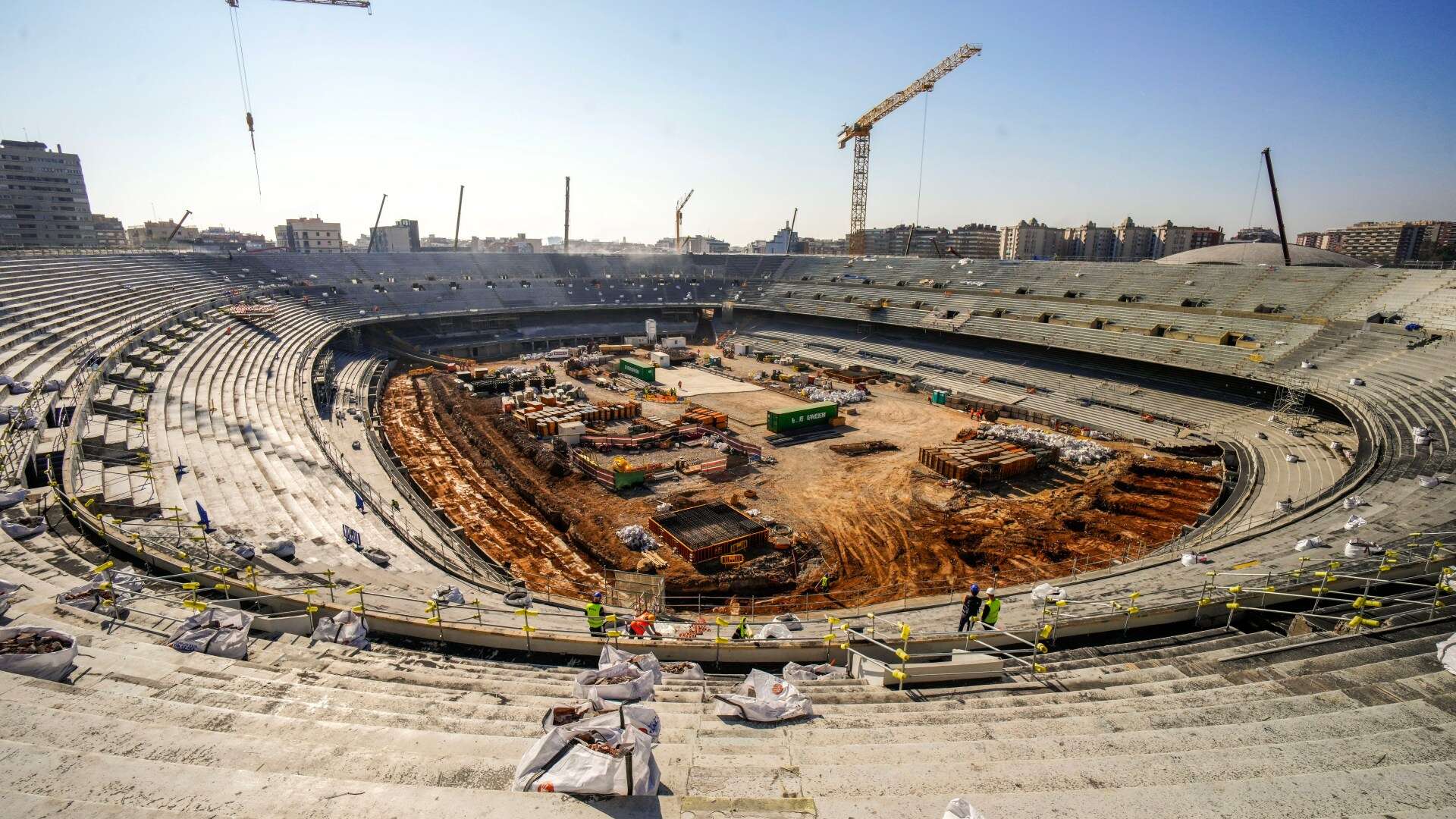 Watch shocking moment 30 Nou Camp construction workers brawl with wooden sticks