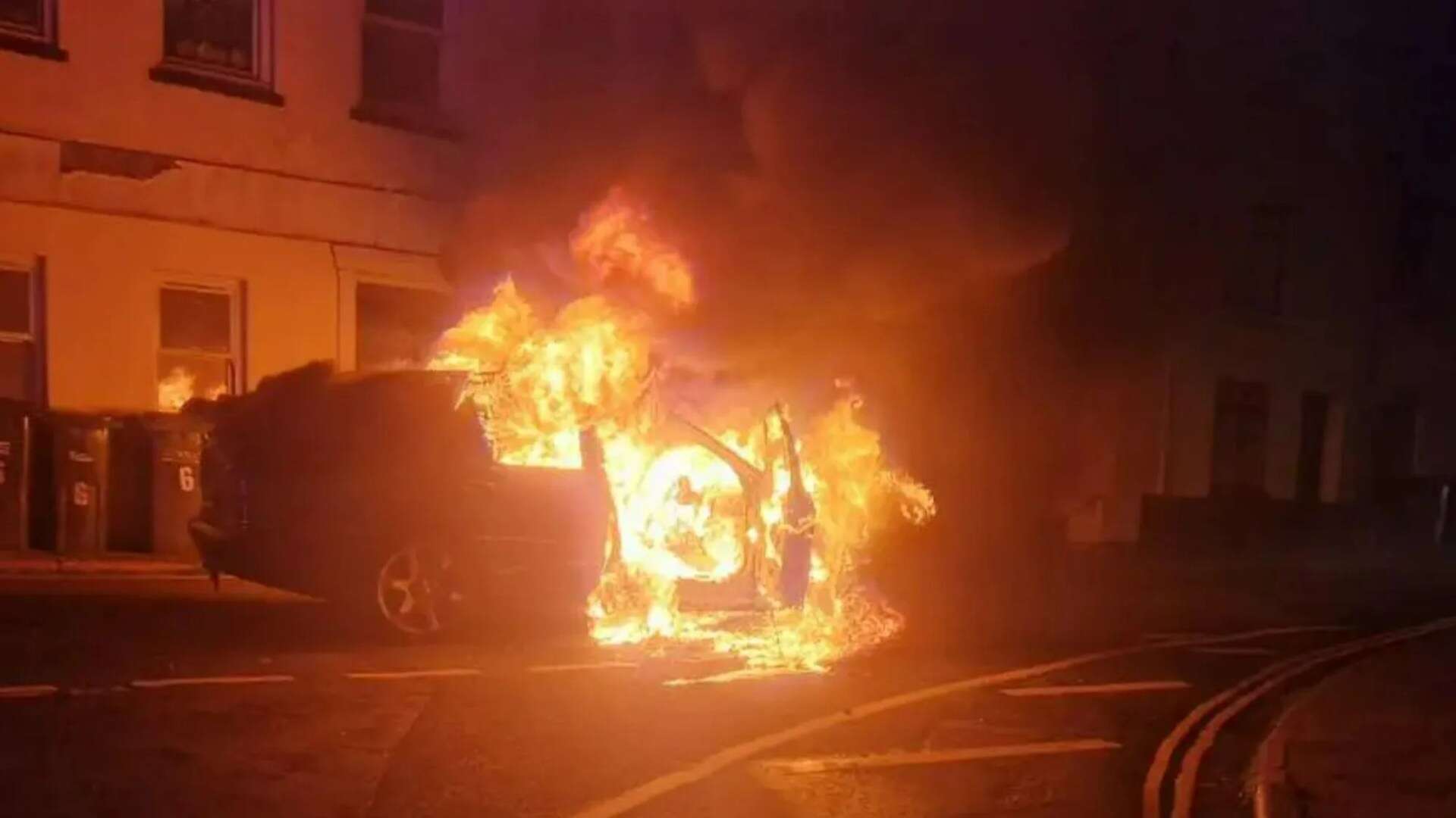 Car is engulfed in flames as sudden explosion leaves charred shell