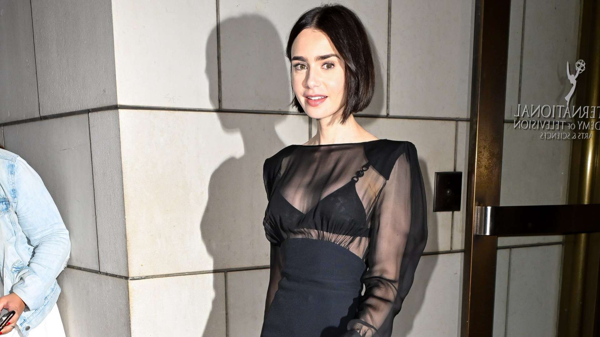 Lily Collins stuns in sheer black mini dress as she steps out in New York