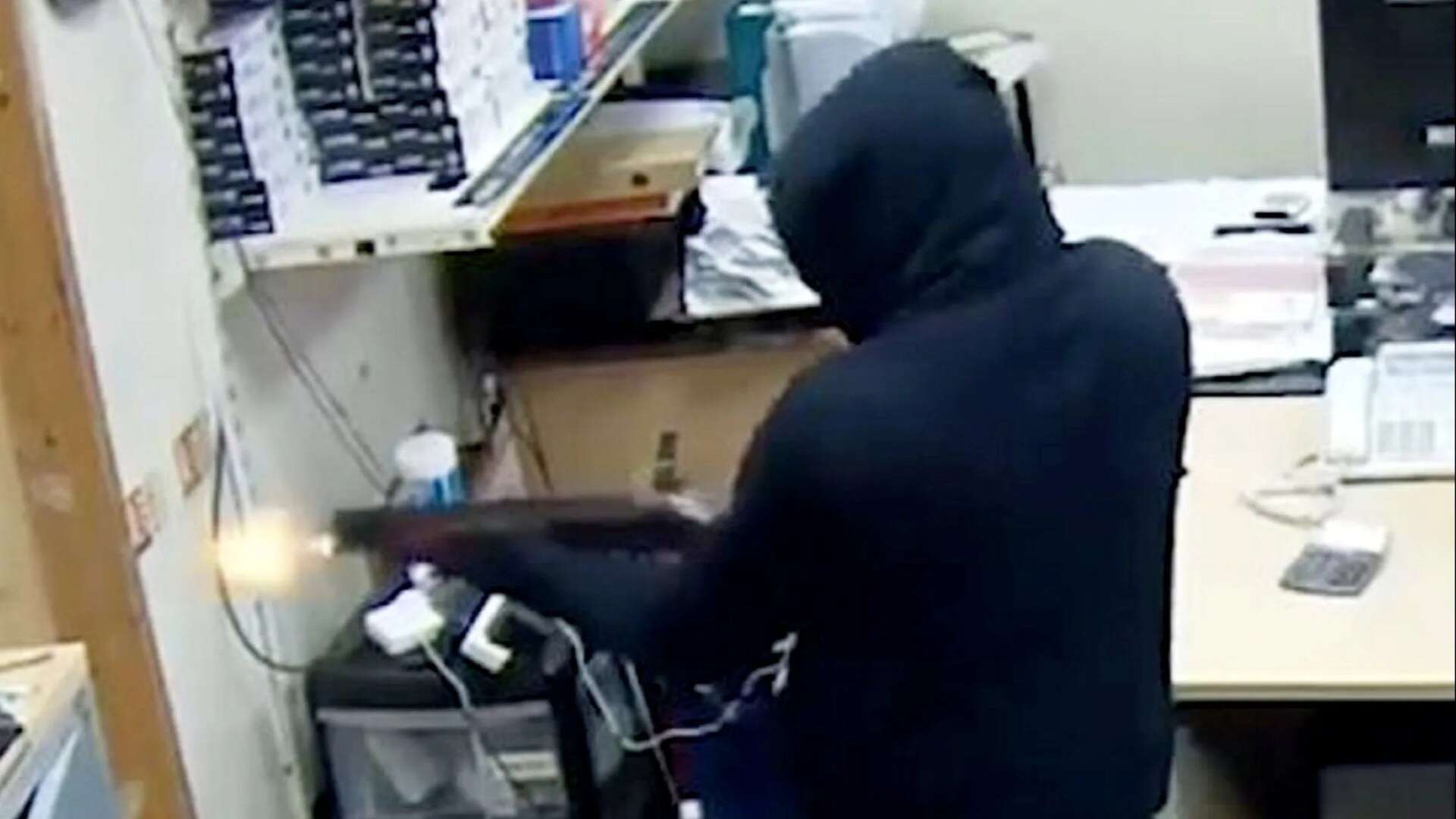 Terrifying moment masked thugs fire SHOTGUN at workers in brazen daylight raid