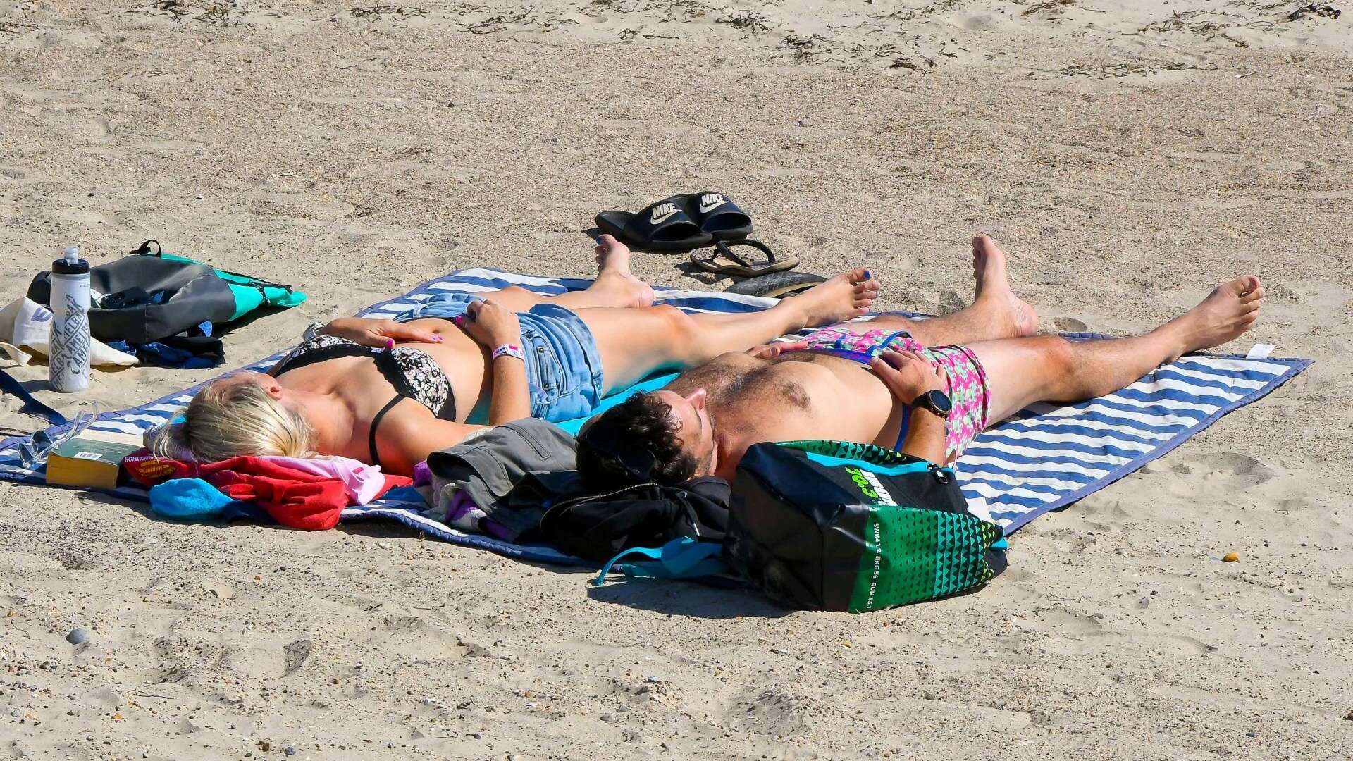 Sunseekers flock to beaches to catch 19C rays with UK 'feeling warm' again