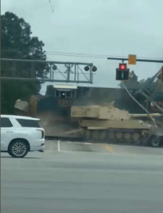 Moment train smashes into truck carrying tank SECONDS after driver escaped