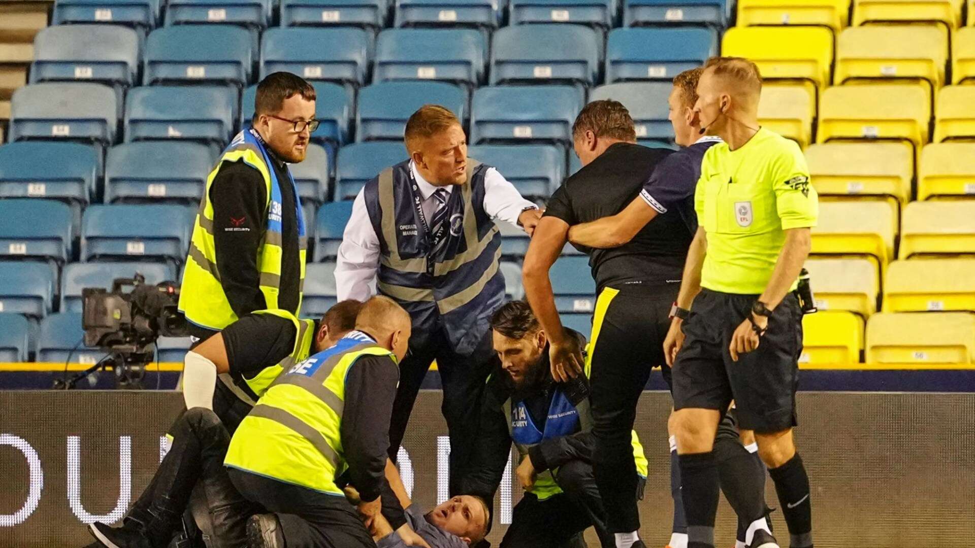 Carabao Cup clash suspended as pitch invader restrained by goalkeeping coach