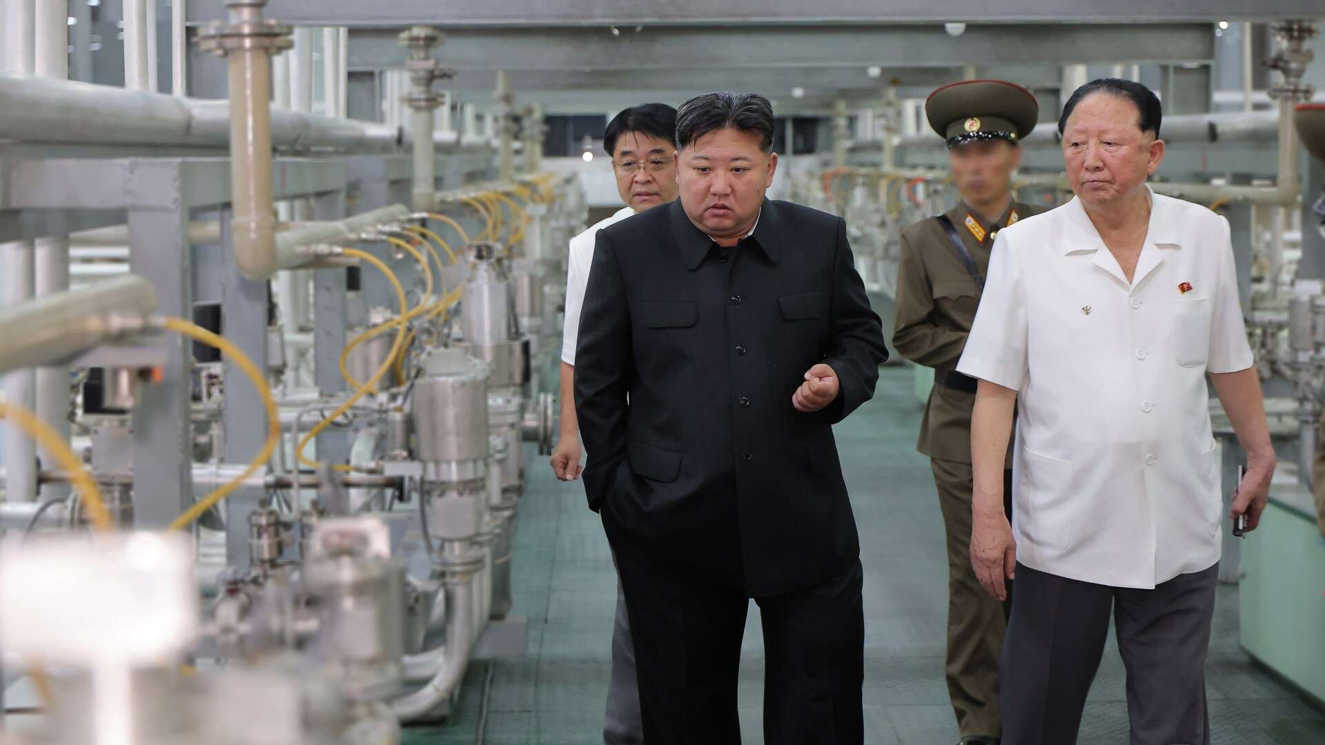 Pics show N.Korea's nuke facility for 1st time as Kim vows to boost arsenal