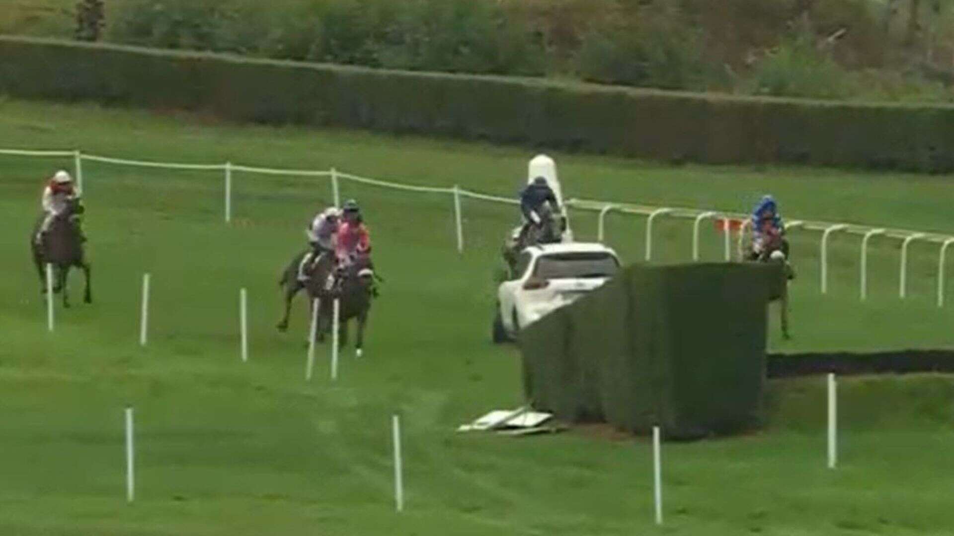 Punters rage at horse racing 's*** show' as CAR is parked in track mid-race