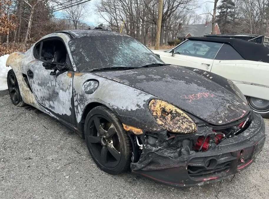 Porsche Cayman completely gutted in blaze - but it 's up for a bargain sum