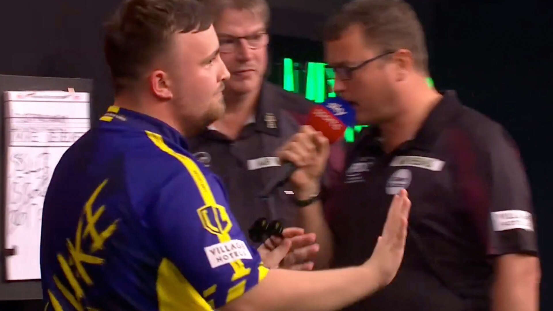 Littler refuses to celebrate after surviving match dart in Grand Slam Darts