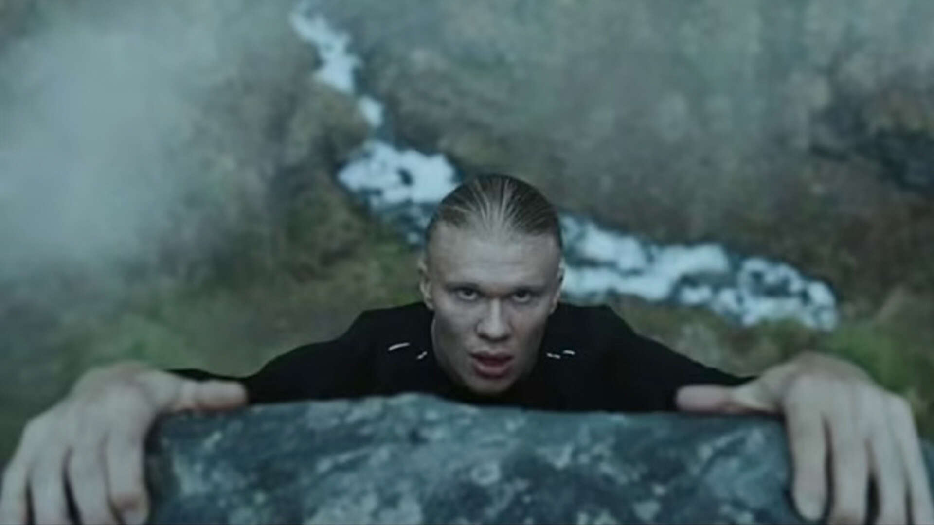 Erling Haaland does pull ups on cliff edge and runs with wolves in insane ad