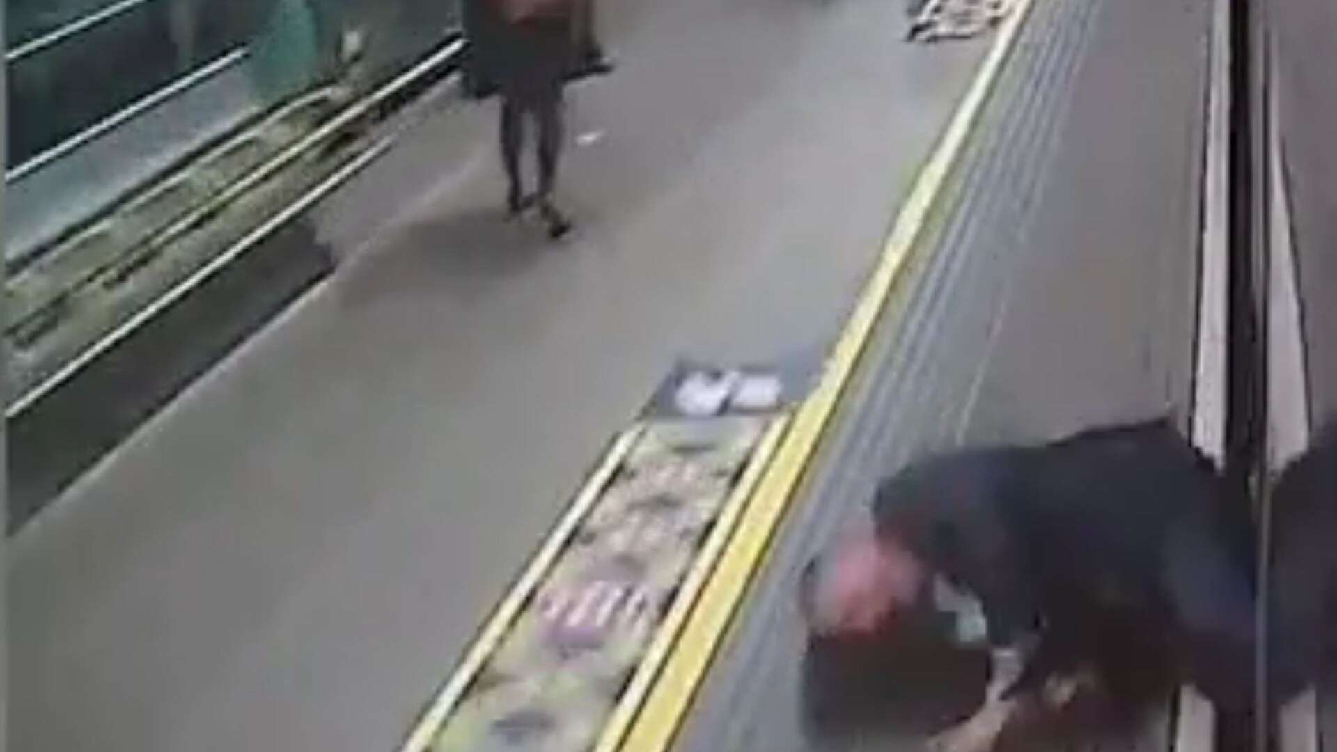 Moment passenger nearly dragged to his DEATH by train pulling into station