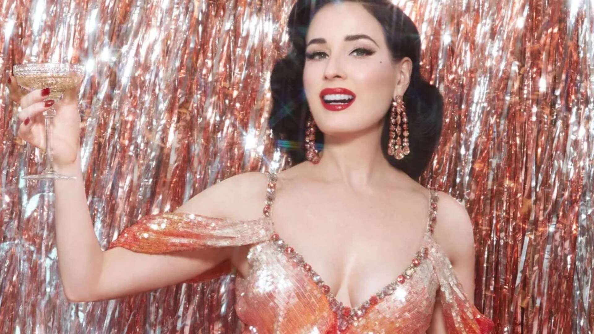 Dita Von Teese shows off her curves in gown as she promotes Las Vegas residency