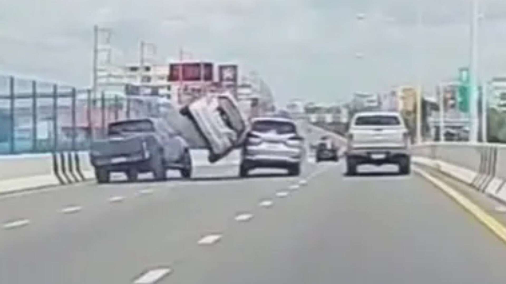 Moment driver crashes through motorway bridge while overtaking lane-hoggers