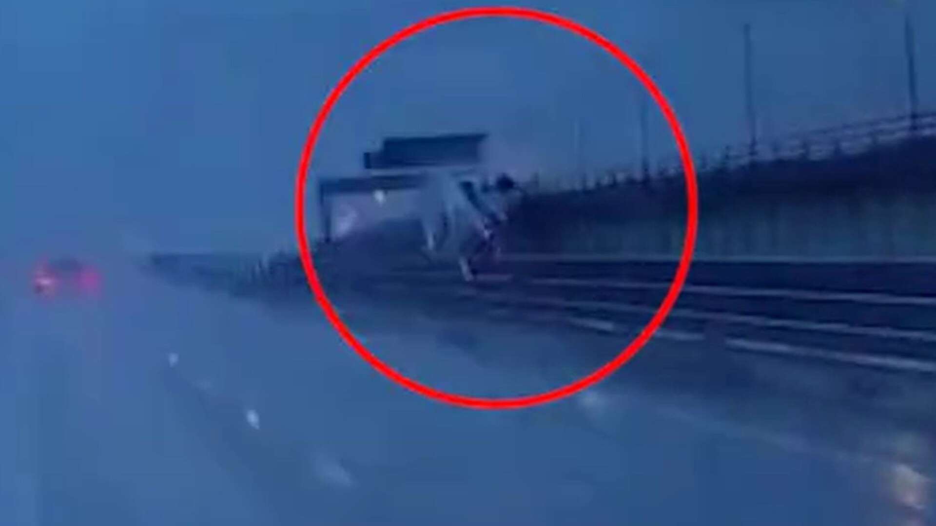 Dramatic moment lorry crashes through bridge barrier & plunges 60ft