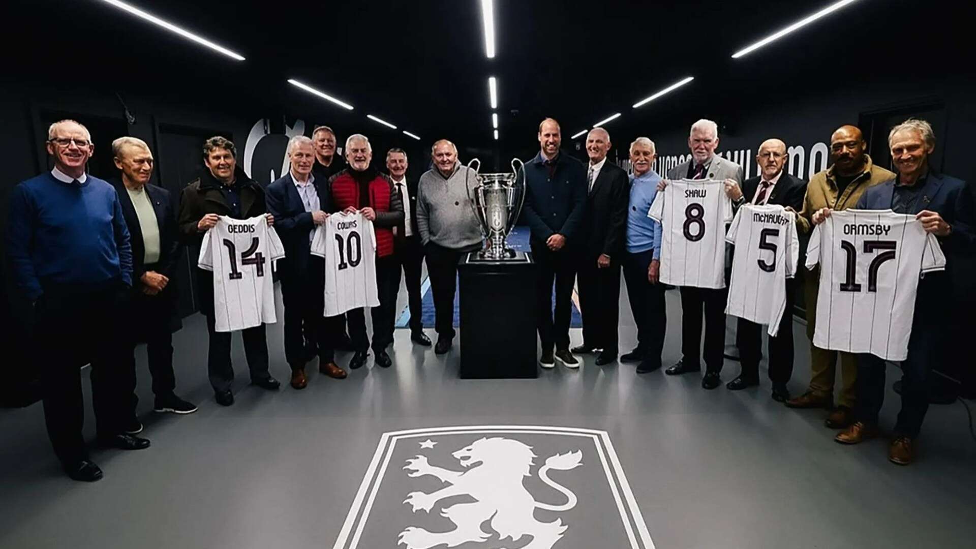 Beaming Wills poses with Villa & Bayern Munich legends as he cheers on his side