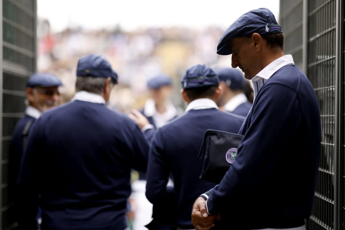 Uniformed protesters criticise introduction of AI line calls at Wimbledon