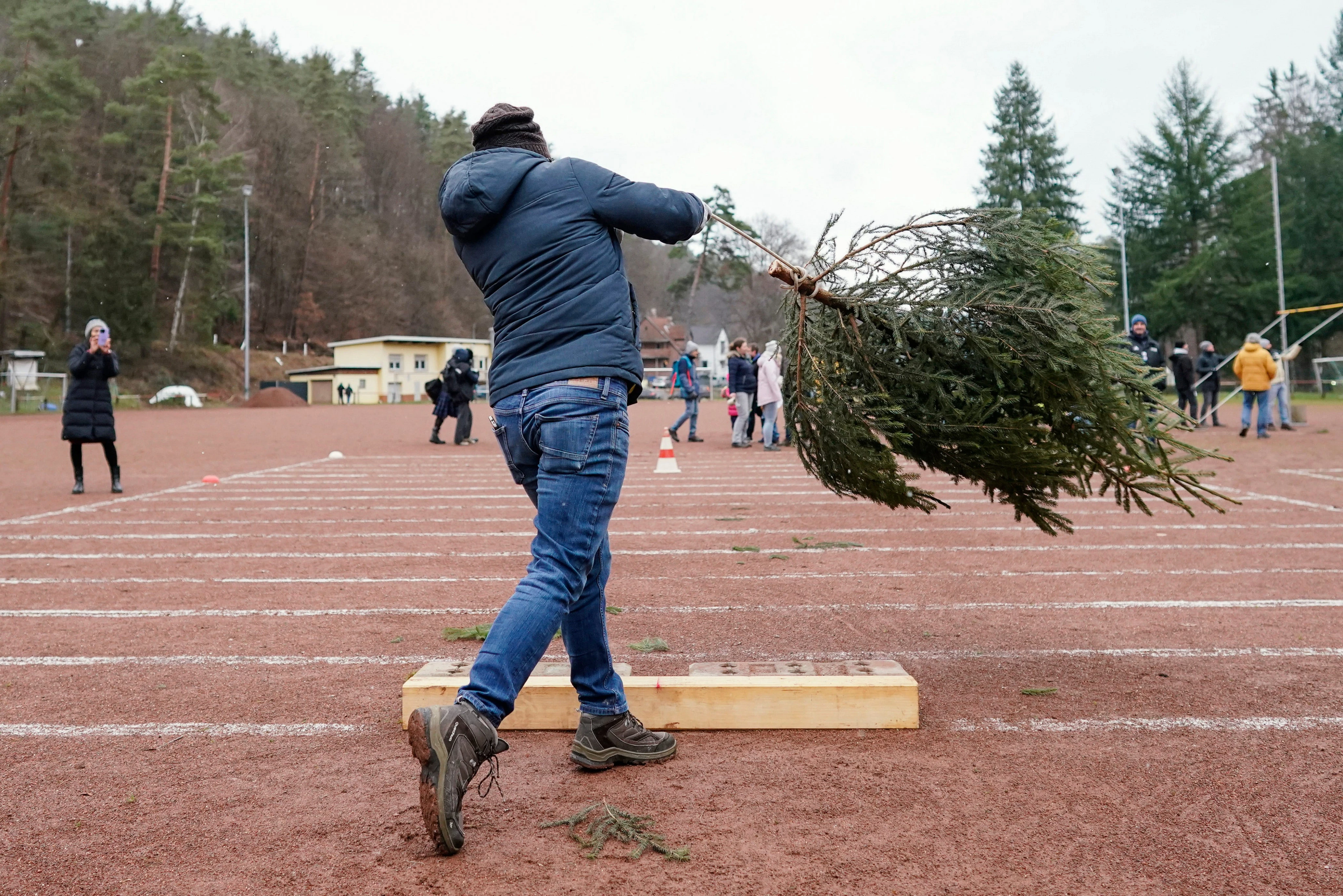 A woman lost her $823,000 injury claim after lawyers found a photo of her winning a Christmas tree-throwing competition