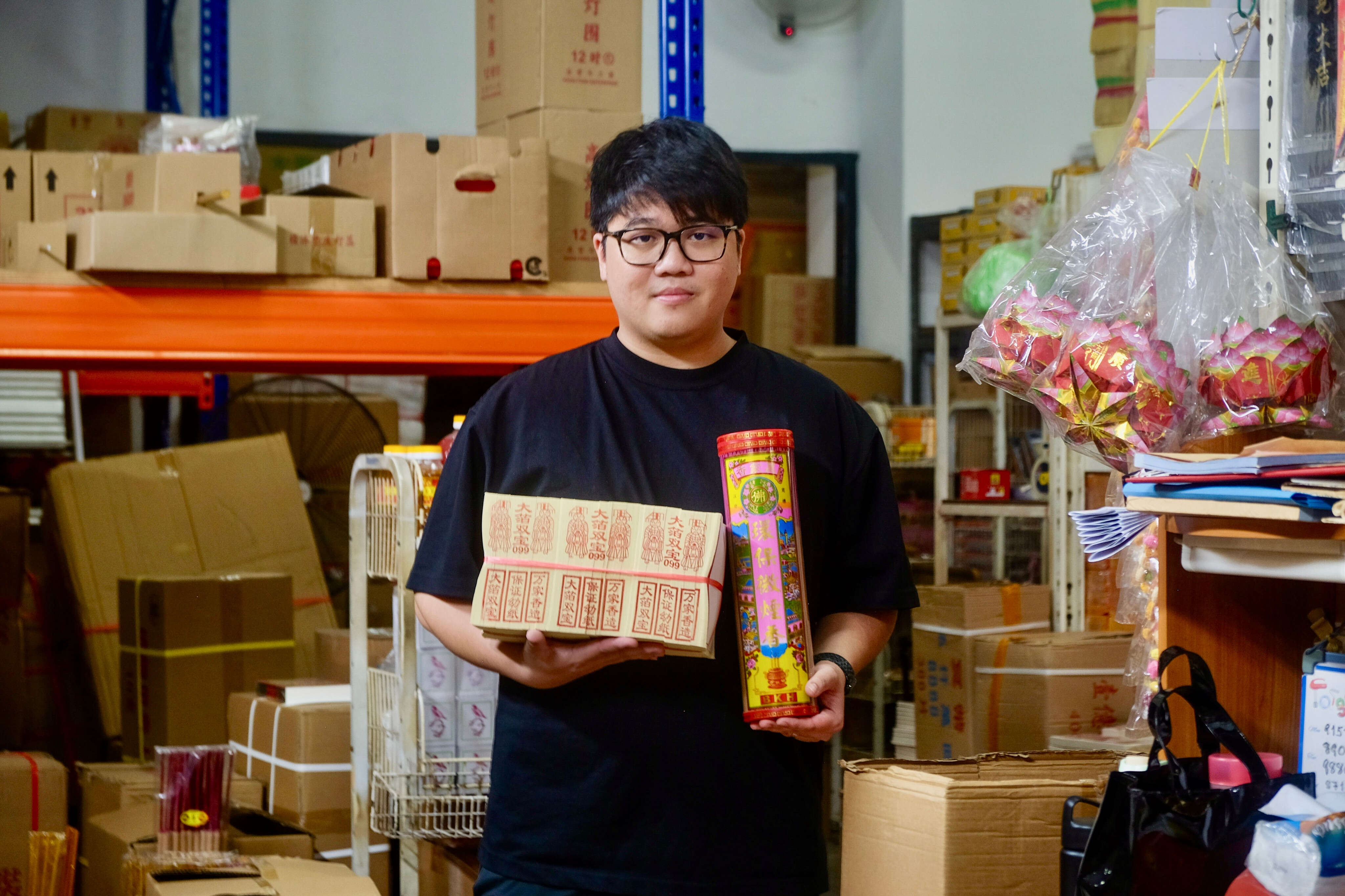 He quit his corporate job at age 28. Now, he runs his family's business of selling paper gifts for the dead.